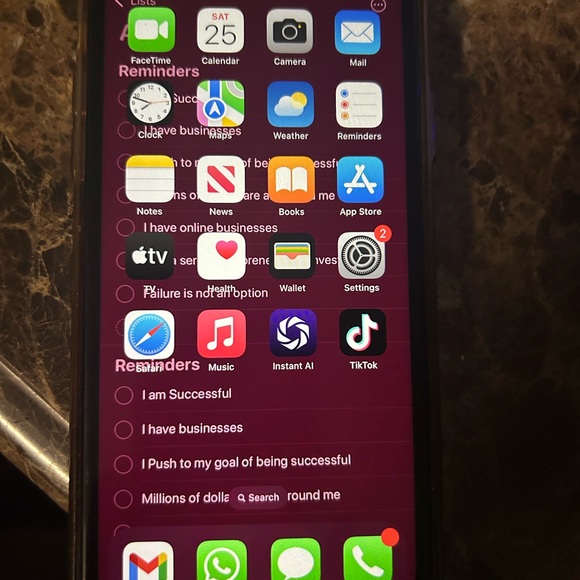 Black Smartphone with iOS Home Screen and Colorful App Icons